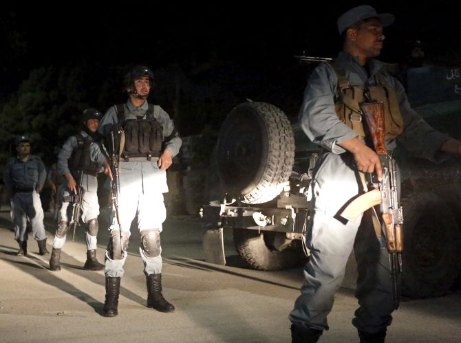 Afghan security forces arrive at the site of an attack in Kabul